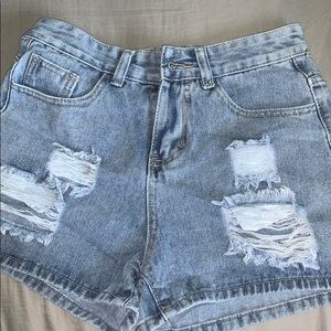 shorts with embroidered flowers on back pocket